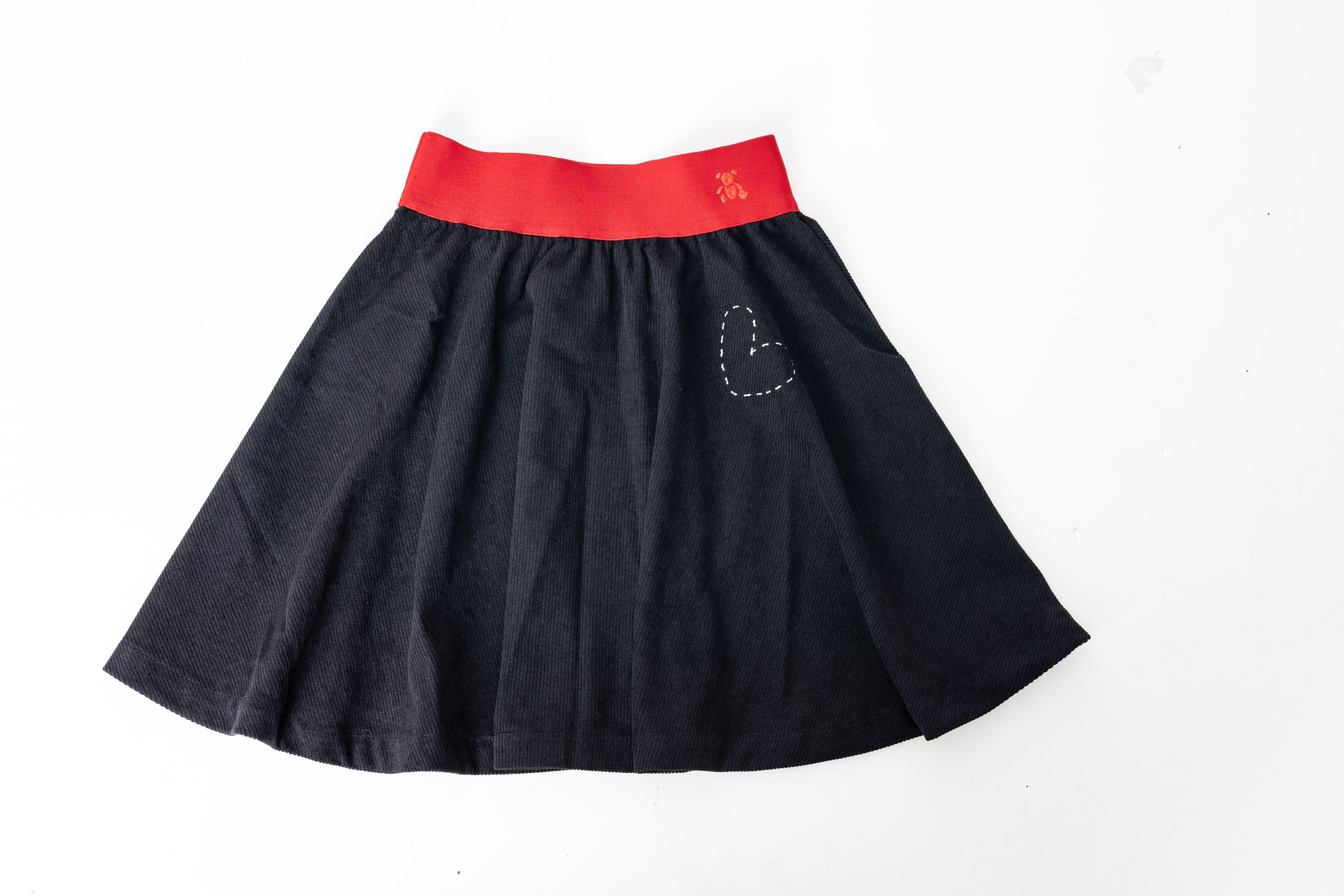 Black corduroy skirt - red
